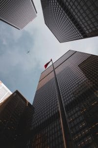 Picture of Skyscrapers and an Airplane flying above